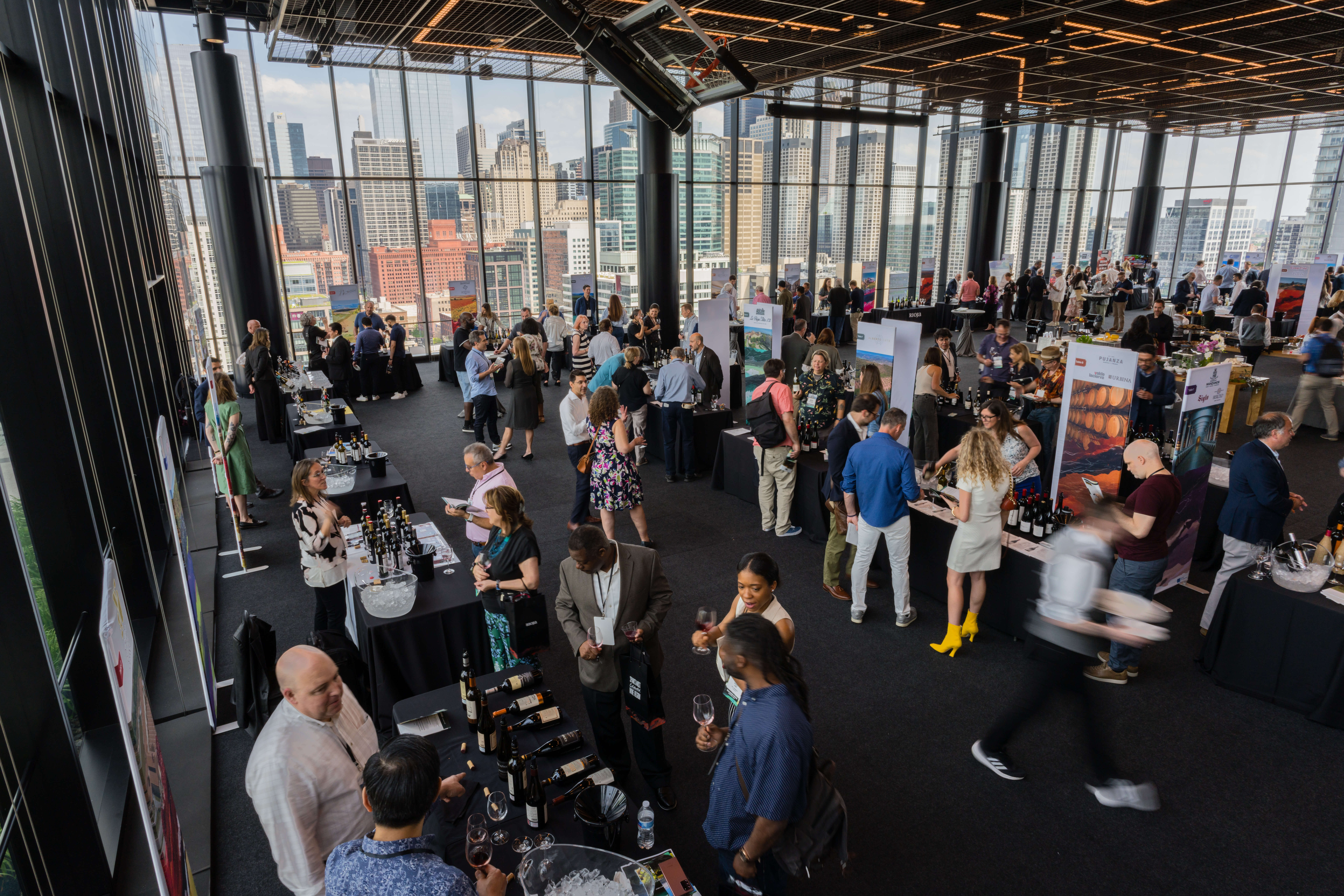 Overhead shot of a crowded room of people tasting wine